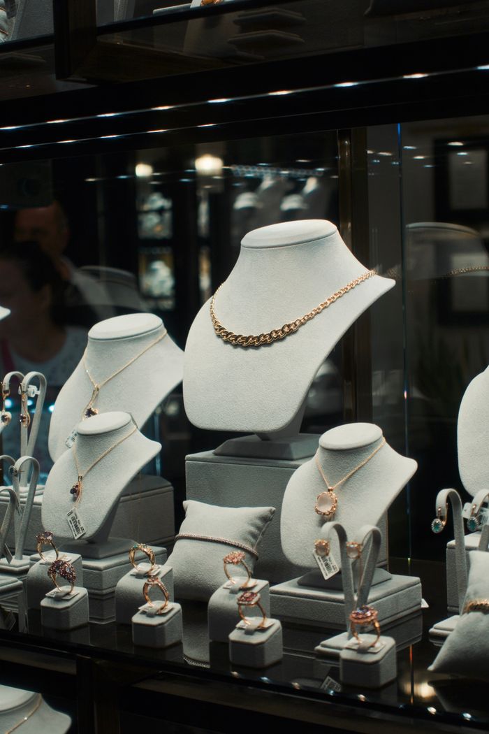 Elegant jewelry pieces elegantly arranged in a retail display case.